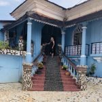 Jayne standing on steps ready for yoga in Goa in Nepal