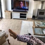 Jayne sitting on sofa watching TV not keeping fit over 50