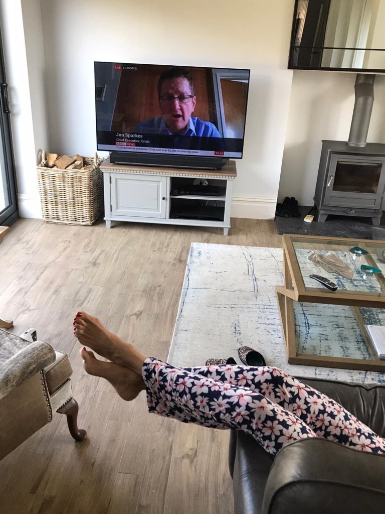 Jayne sitting on sofa watching TV not keeping fit over 50